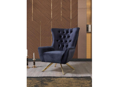 Luxurious blue Chesterfield armchair with velvet upholstery for the living room