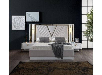 2-bedroom bed with gold trim and matching bedside tables