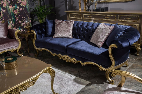 Chesterfield three-seater sofa in a luxurious blue color for the living room