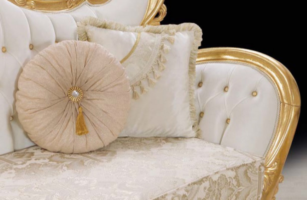 A luxurious and relaxing sofa in classic style with golden patterns