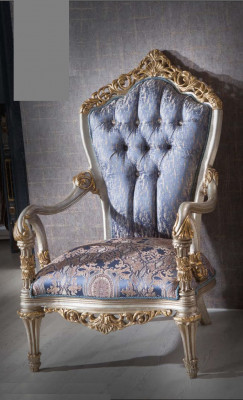 Luxurious armchair in classic style for the living room with golden decorative patterns