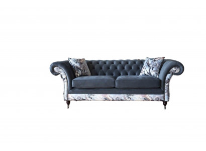 A striking three-seater sofa in a Chesterfield design with delicate gray floral decoration