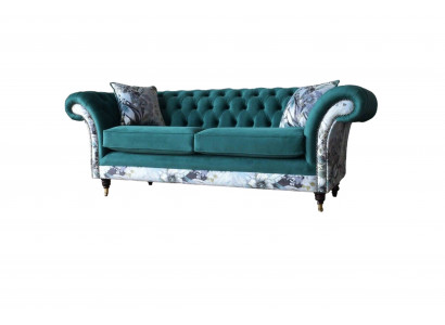 A vibrant three-seater Chesterfield sofa in a delicate emerald color with a floral pattern